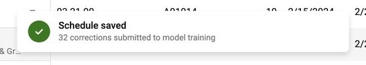 Save confirmation toast: Schedule saved, 32 corrections submitted to model training.