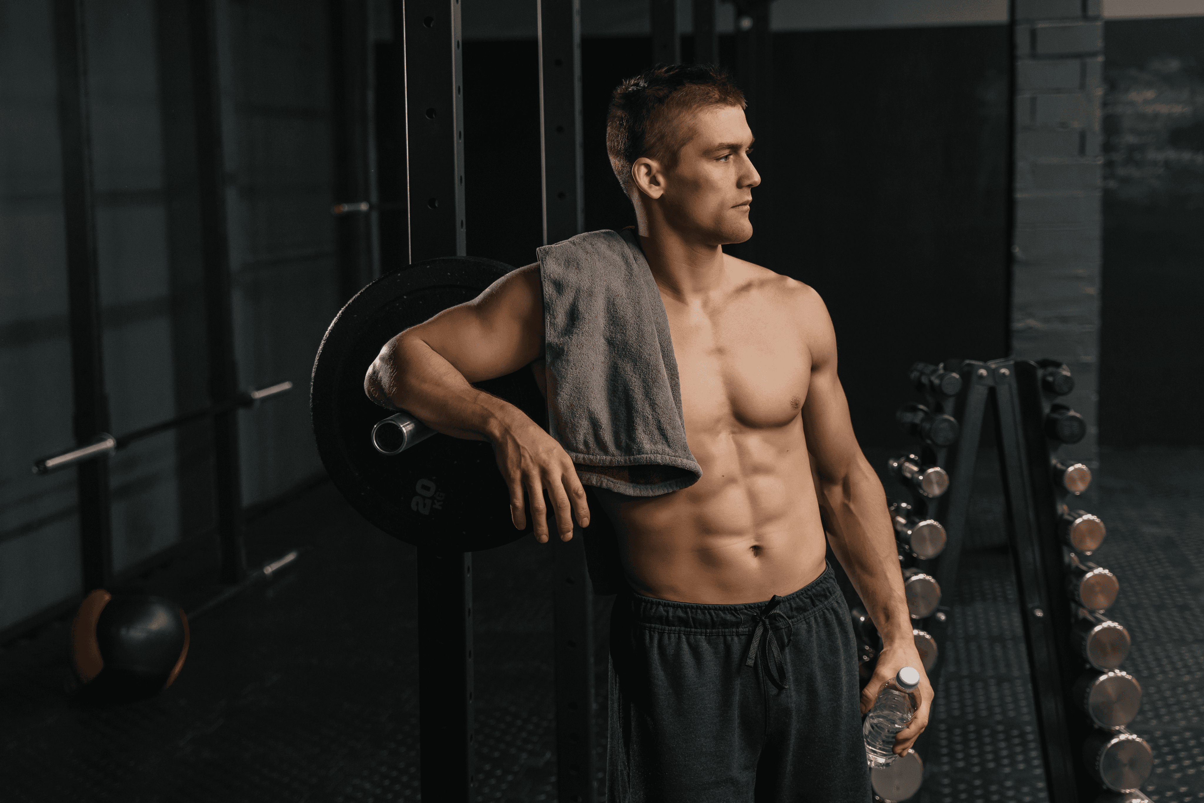 athletic man resting in a gym