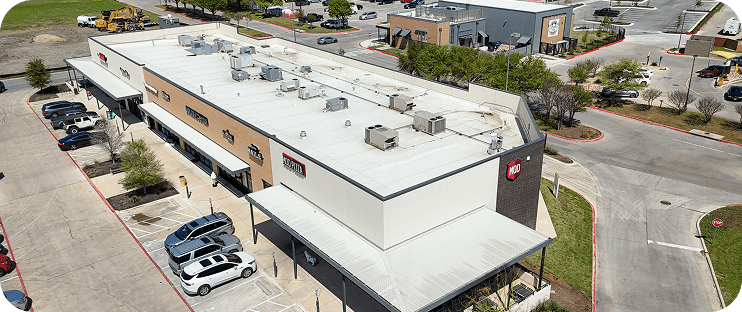Commercial TPO roof with metal roof patio
