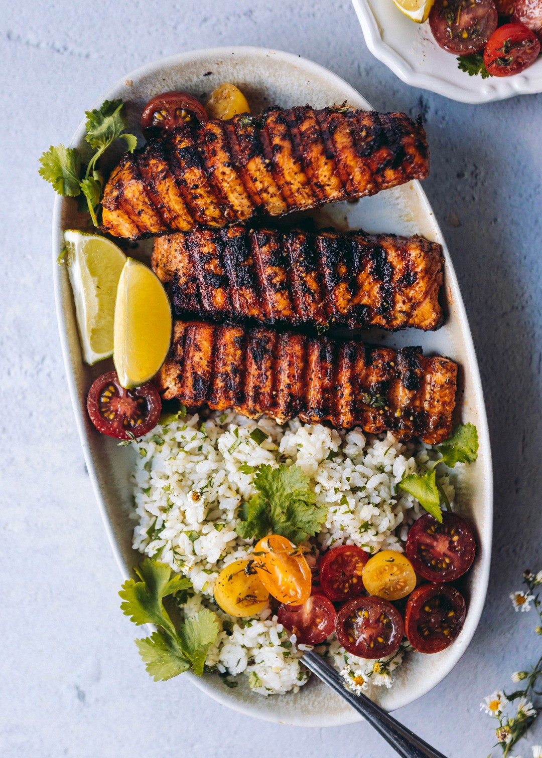 Grilled salmon served with cilantro rice, refried black beans, and chipotle agave sauce.