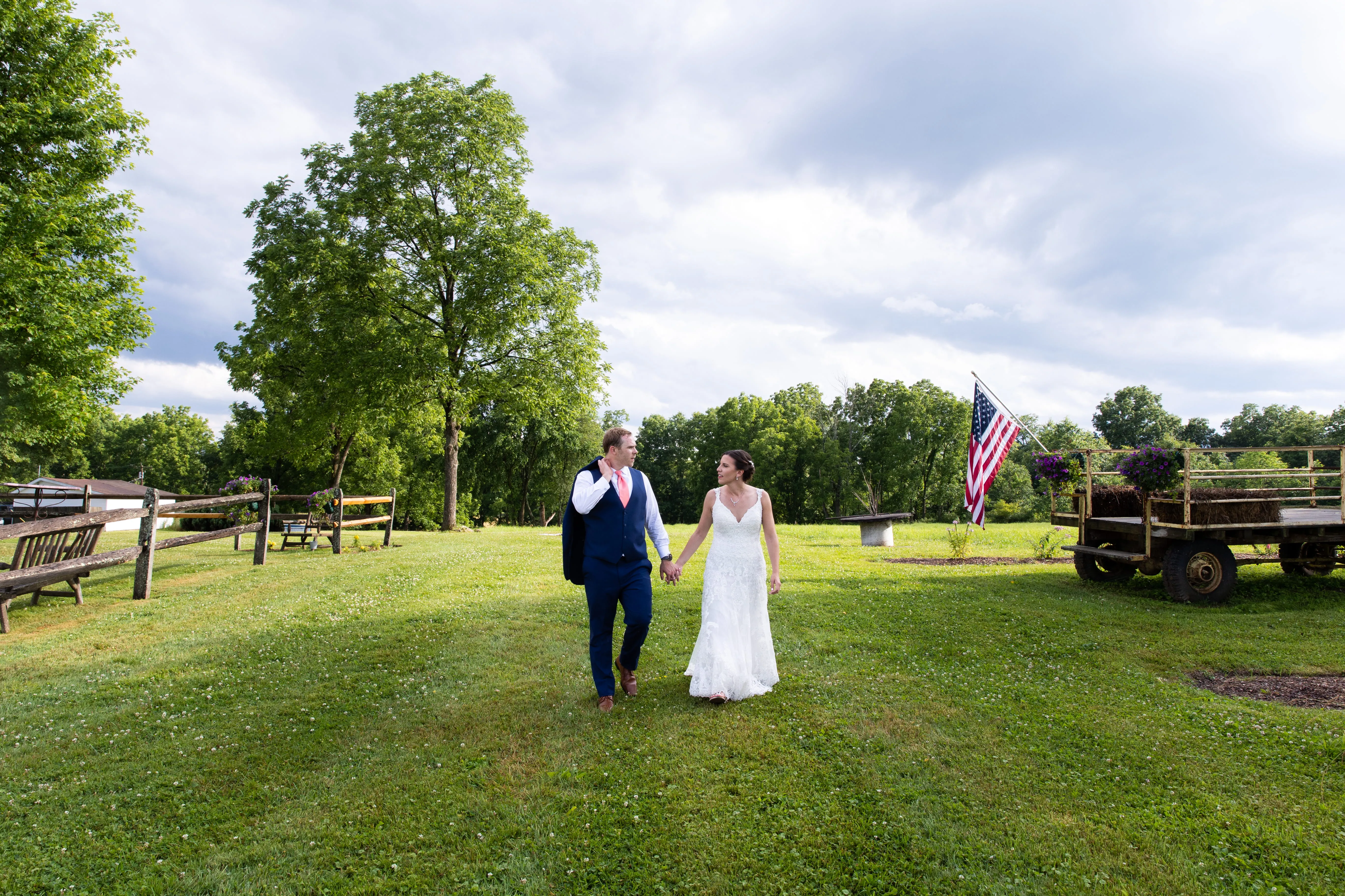 Bride and groom walking outdoors during wedding at scenic venue