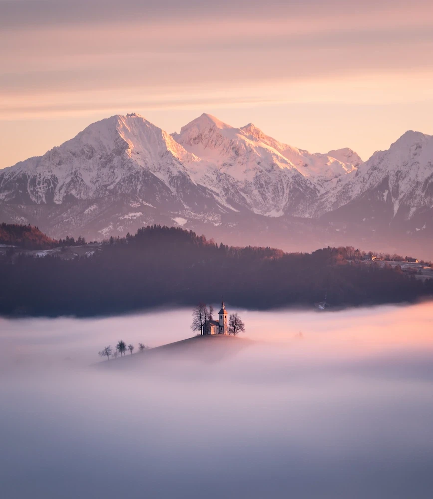 Sveti Tomaž church in Slovenia on a foggy winter morning.