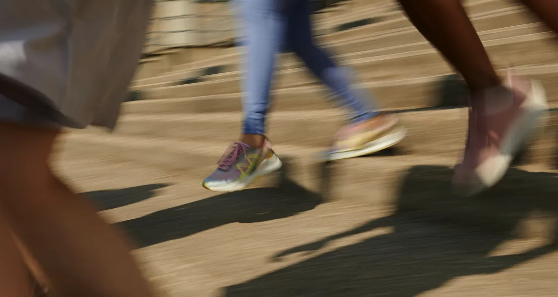 Group of adults running together during an outdoor workout to build fitness, endurance, and long-term health.