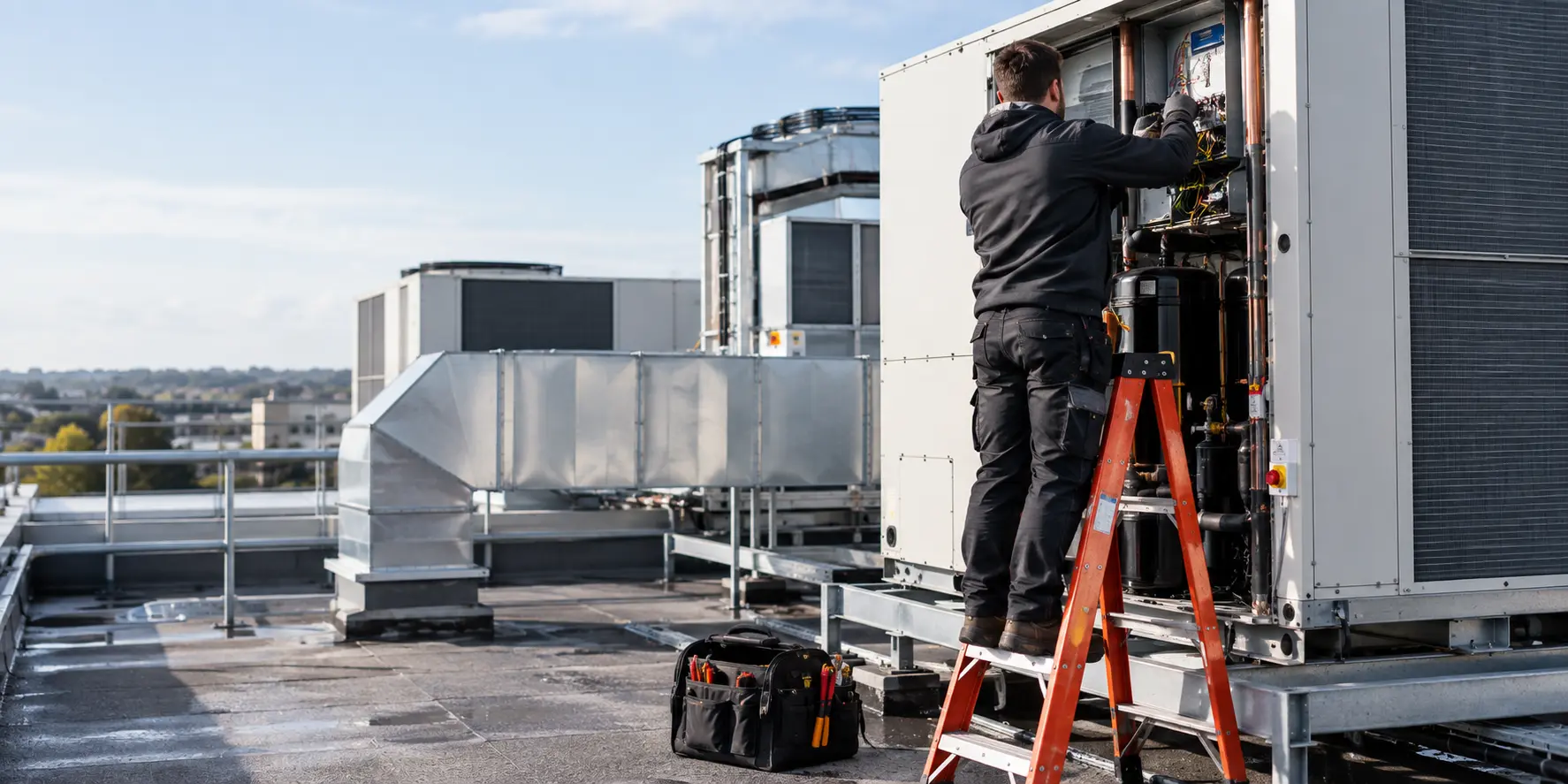 Air conditioning technician workin on commercial HVAC