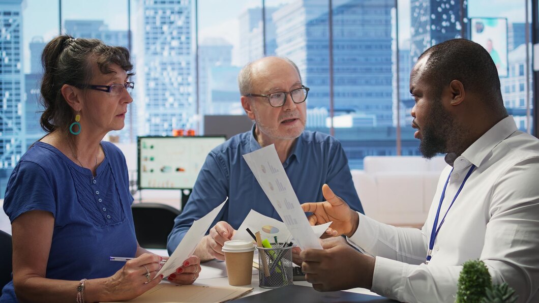 A doctor consulting clients ver their behavioral reports.