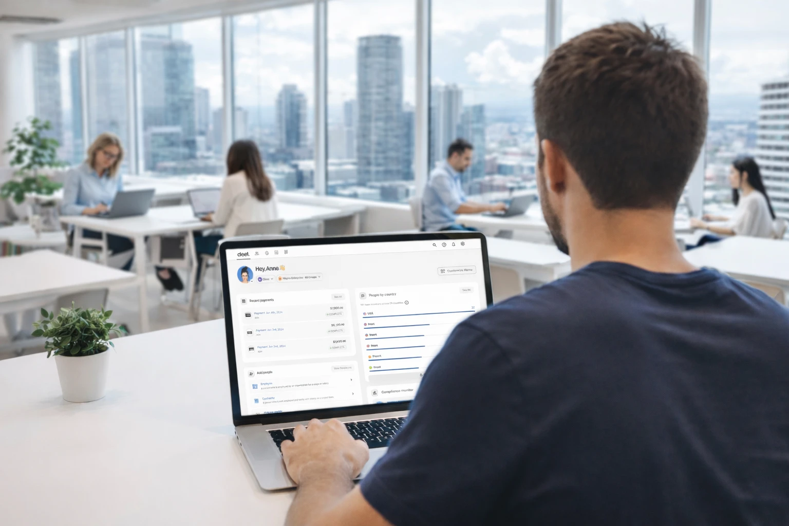 Profesional trabajando en su laptop con la plataforma Deel abierta, representando el proceso de cobrar por Deel desde Argentina.