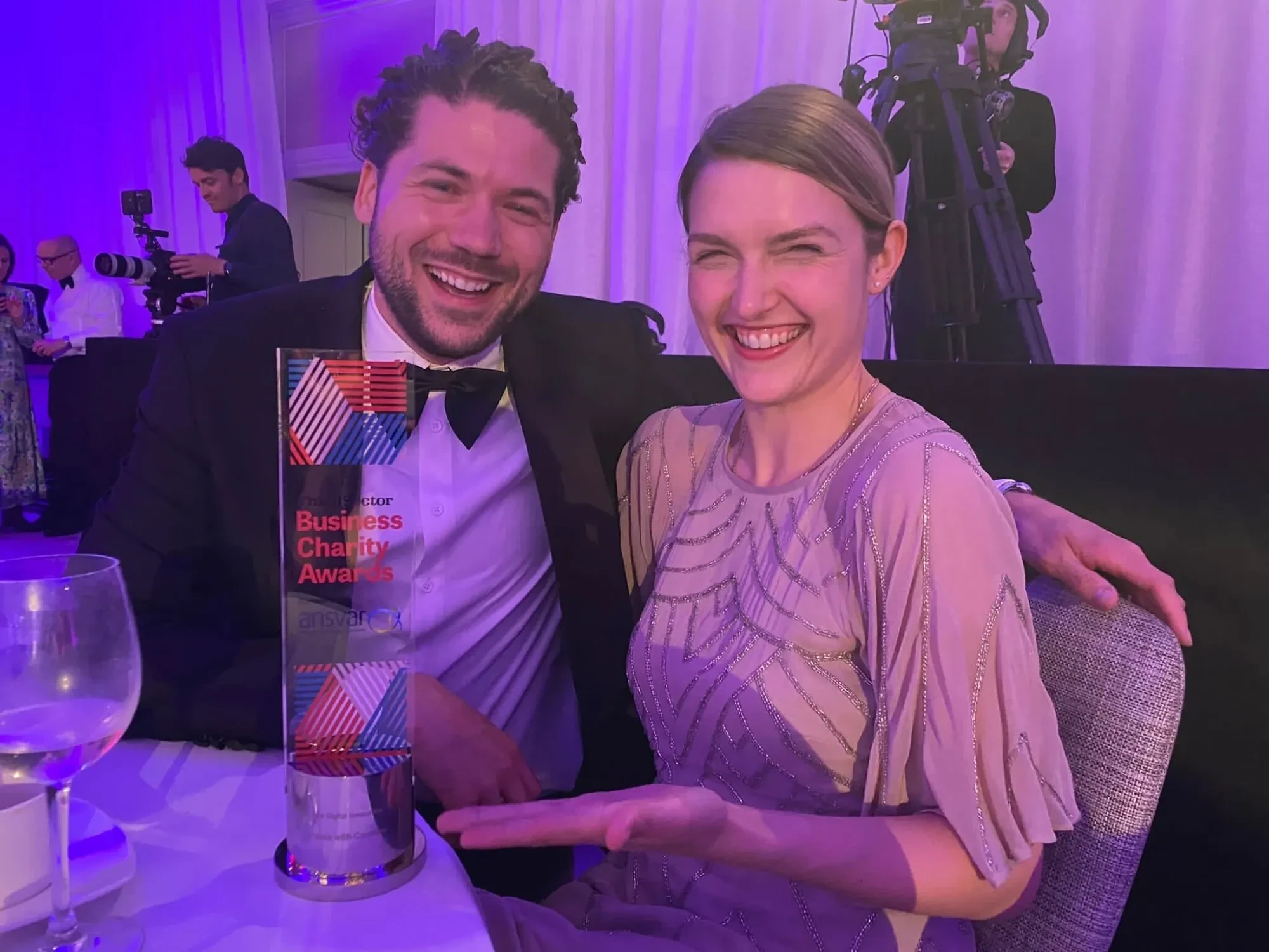 Happy pic of Joey Ceunen, CTO of Carefree with their Senior Product Manager Eleanor from Impala holding Business charity award trophee