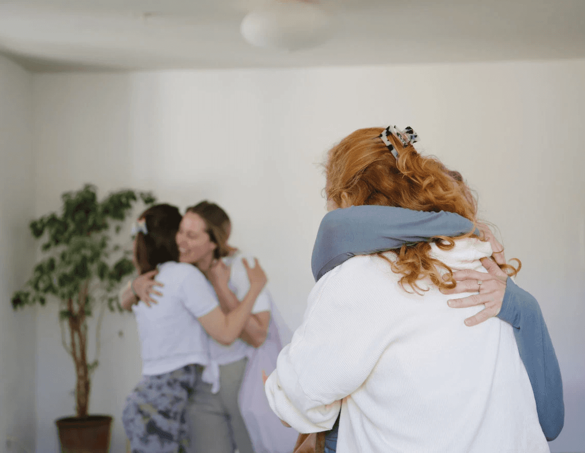 woman in black sports bra and black leggings doing yoga