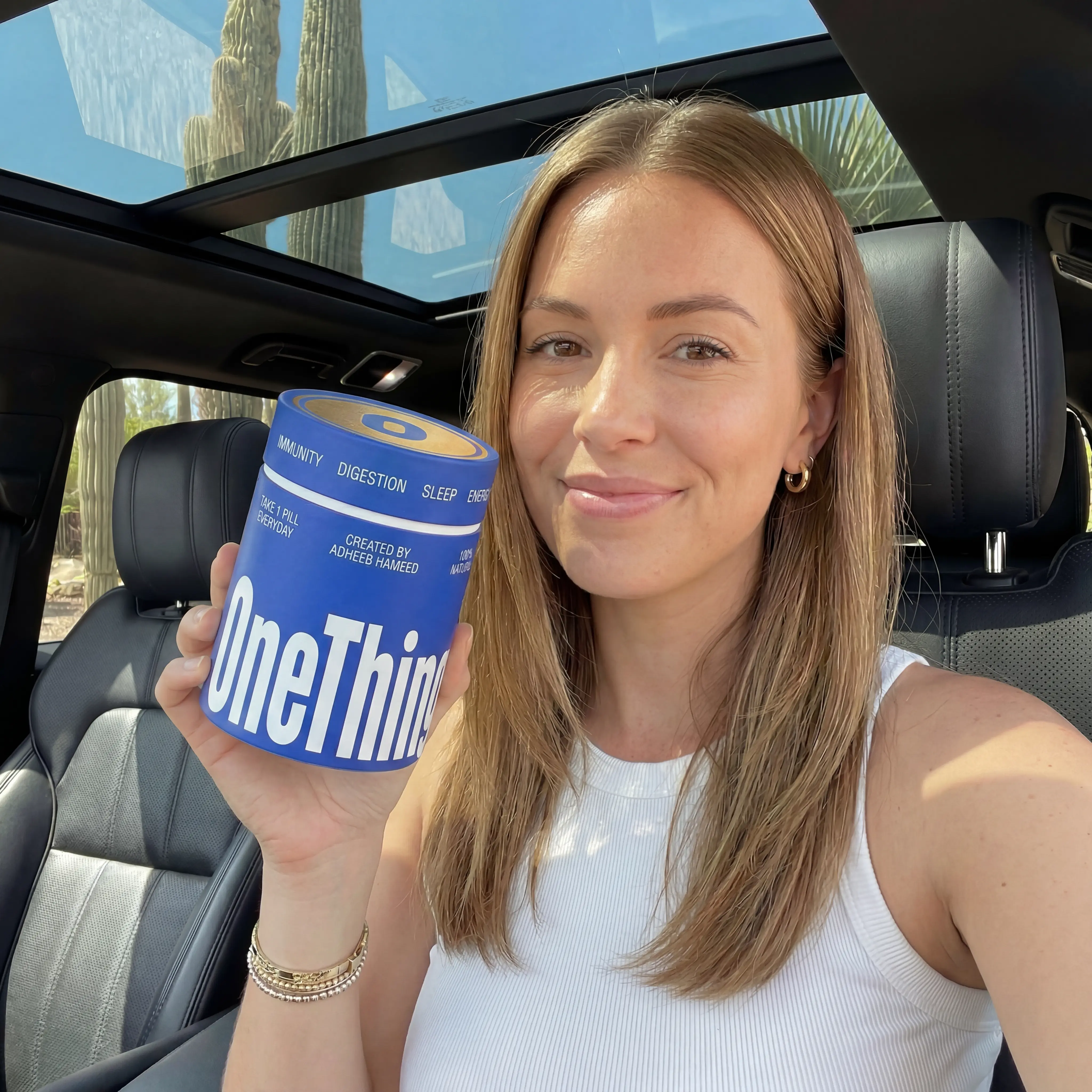 Woman taking selfie with the supplement product