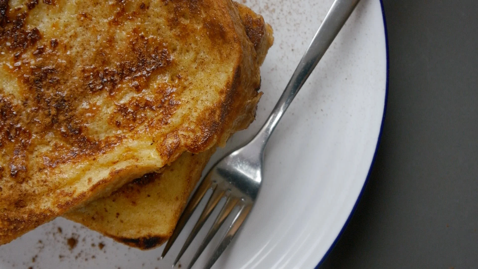 Toast on a plate with a fork