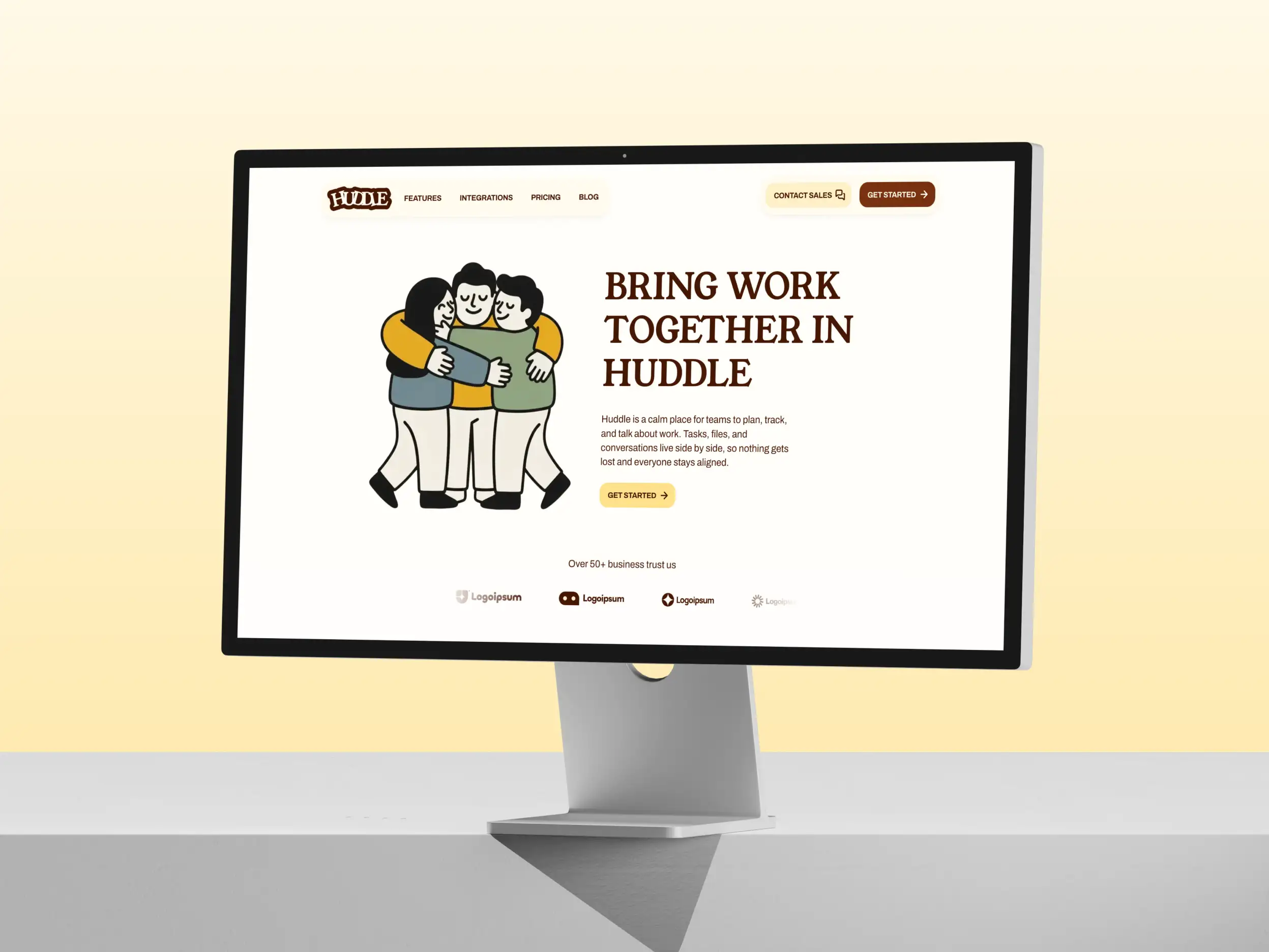 Apple Display monitor with the Huddle template hero section displayed