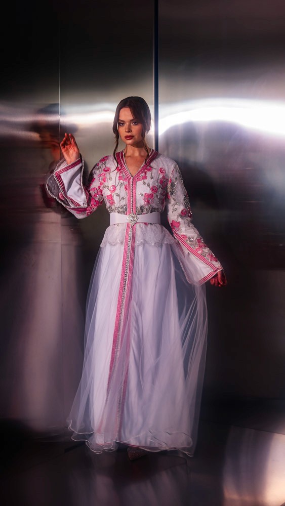 Blush pink Moroccan caftan with delicate embroidery, handcrafted luxury design for refined occasions in Bahrain