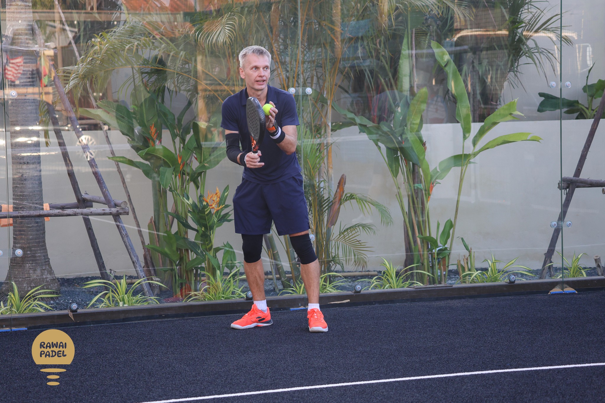 a tennis racket and ball on a court
