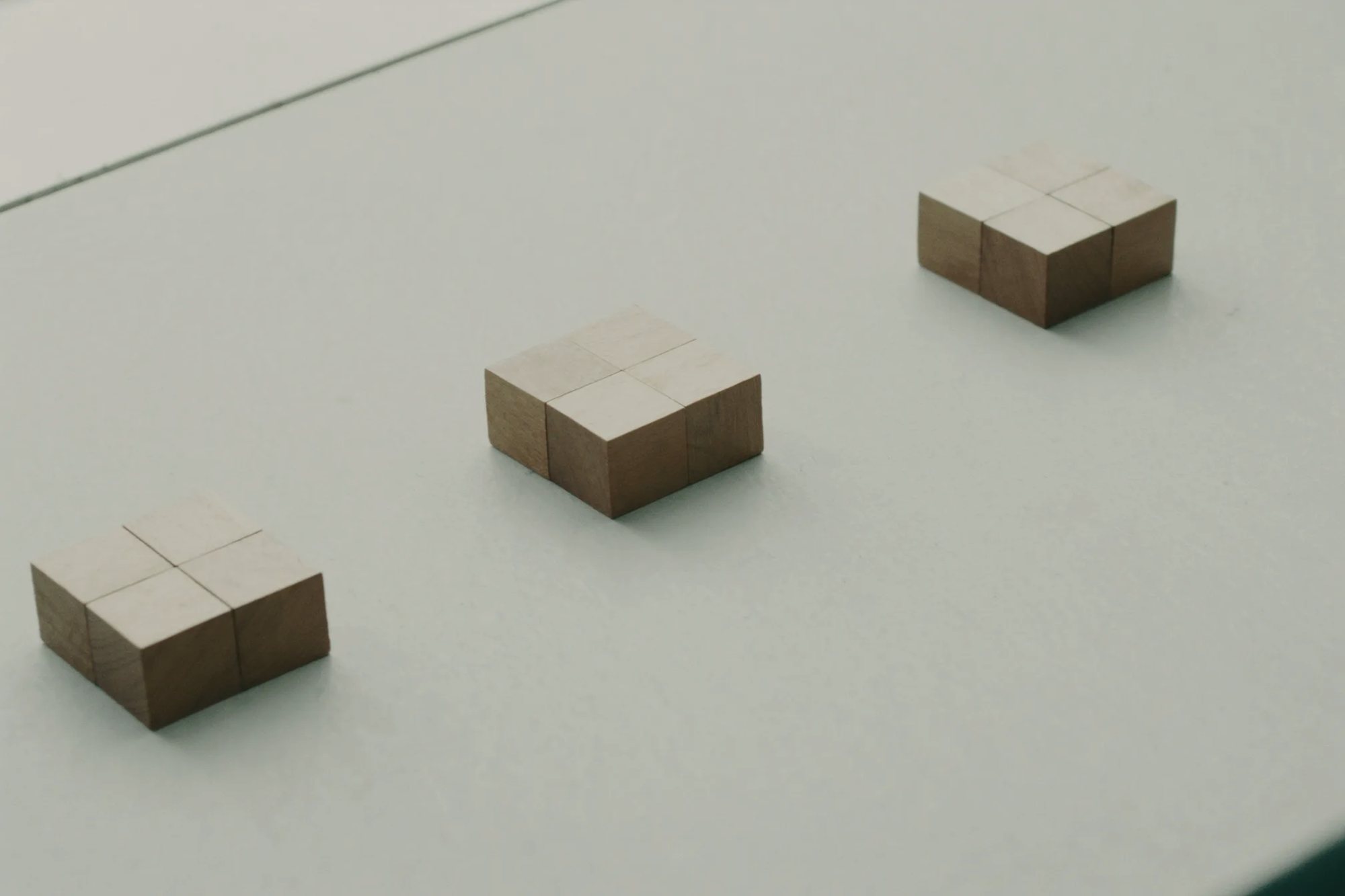 Wooden blocks of three heights on a stone table