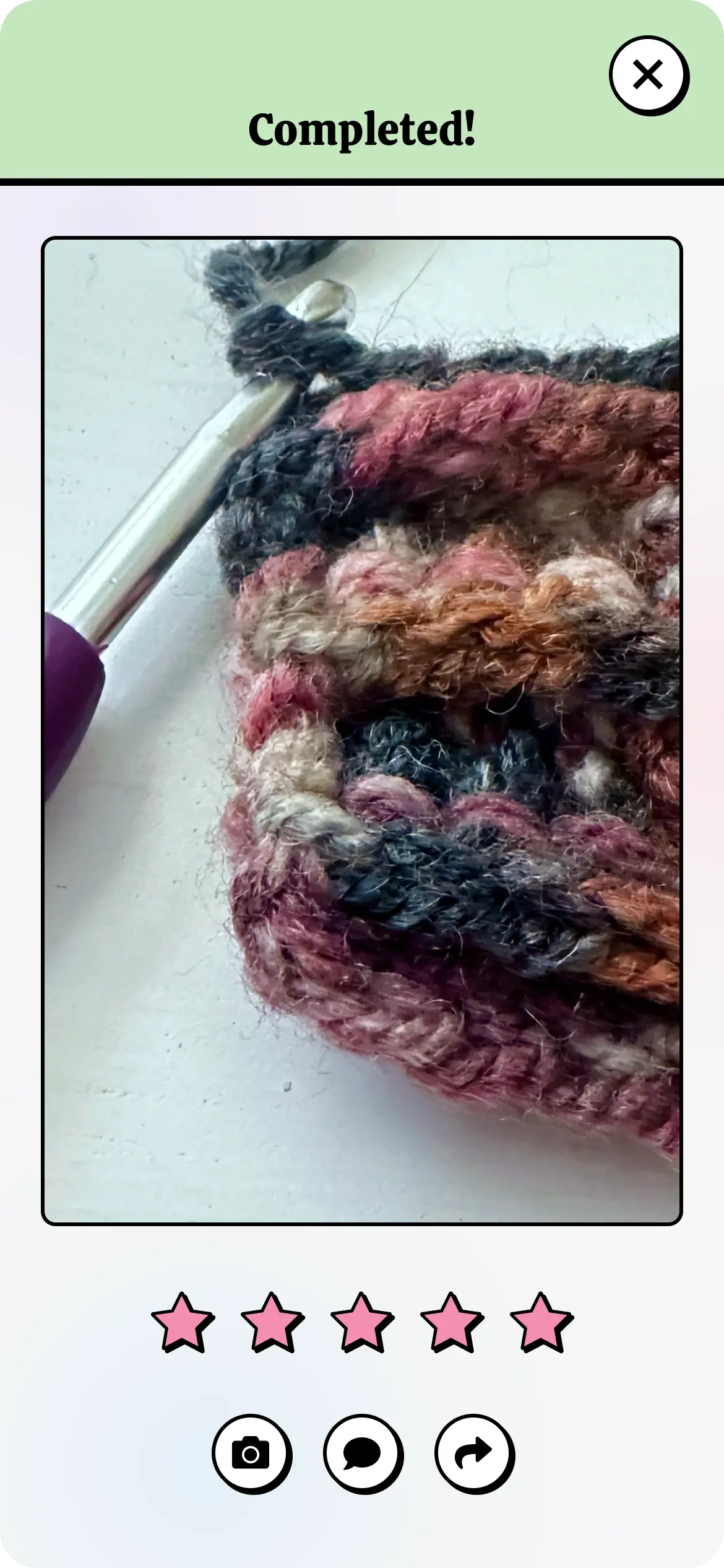 App screen showing the 'Completed!' section of a tutorial with an image of the finished crochet project, options to rate the tutorial, and buttons to capture photos, share progress, or view more projects.