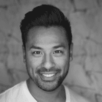 Modern building facade with repeating windows against sky