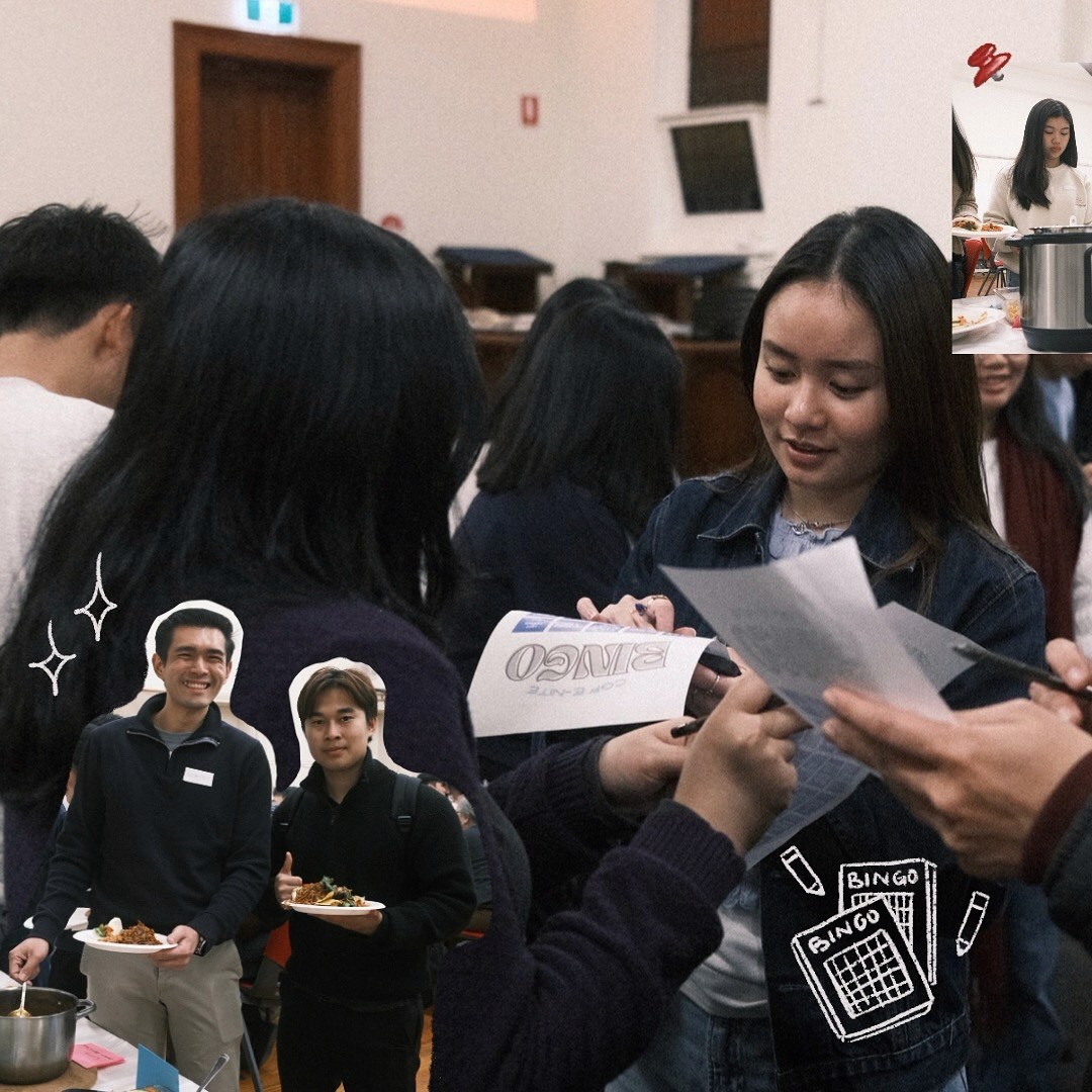 A restaurant interior featuring marble countertops, brown leather chairs, wood-paneled walls, and round pendant lights hanging above a bar set with wine glasses.