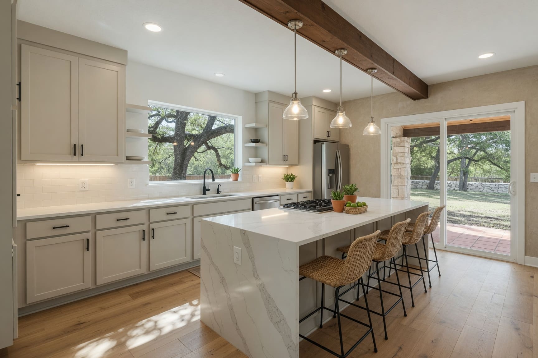Modern kitchen with marble island and white cabinetry