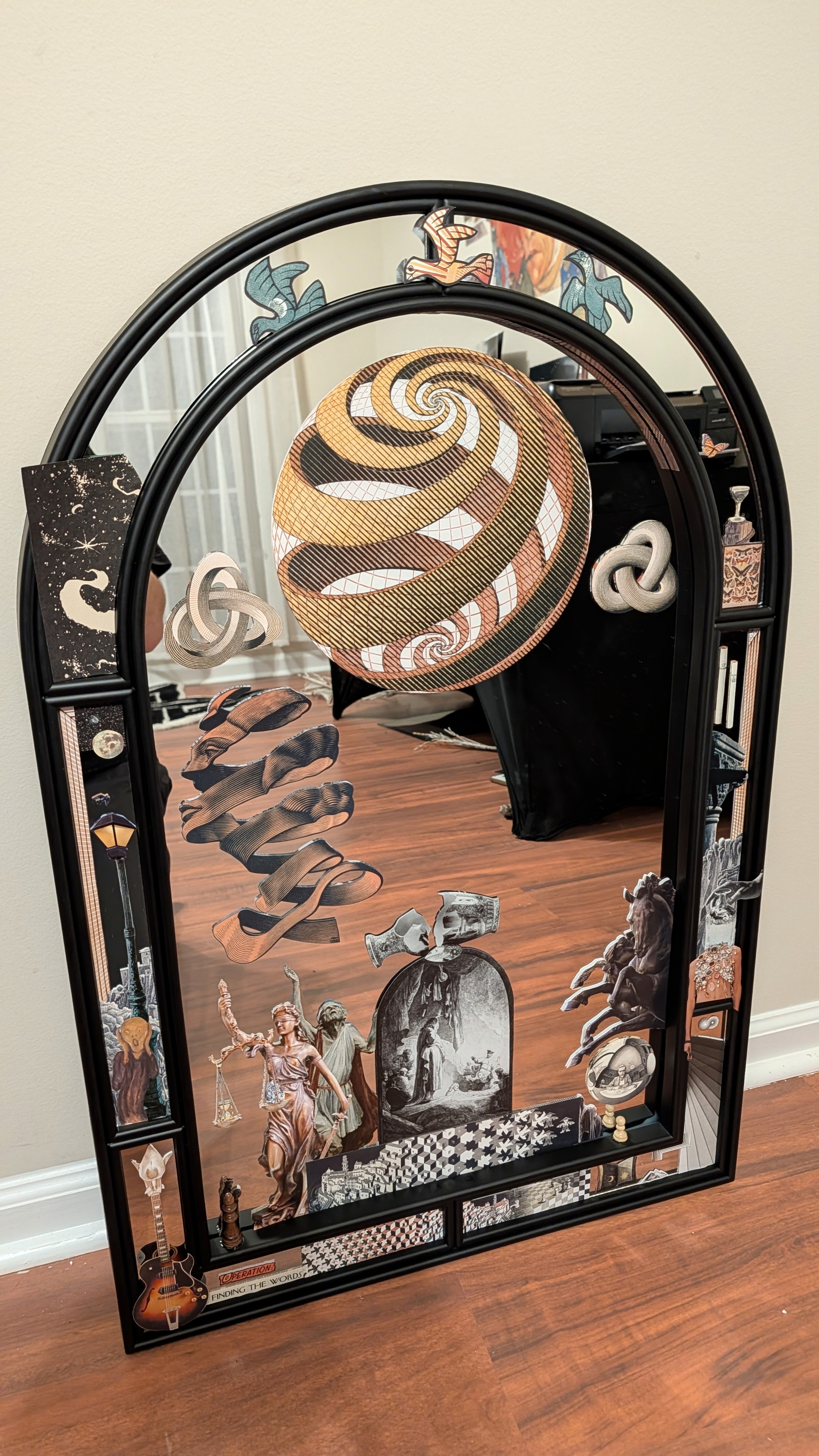multimedia collage piece on a mirror
