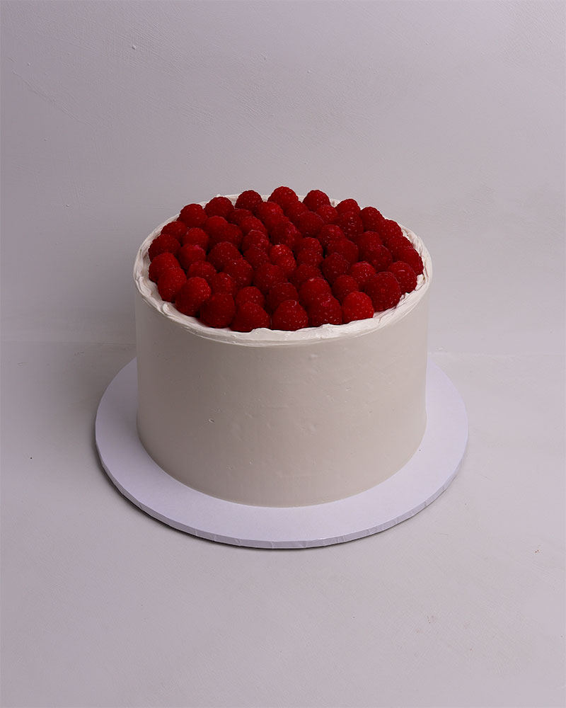 black and white birthday cake with bows and hearts