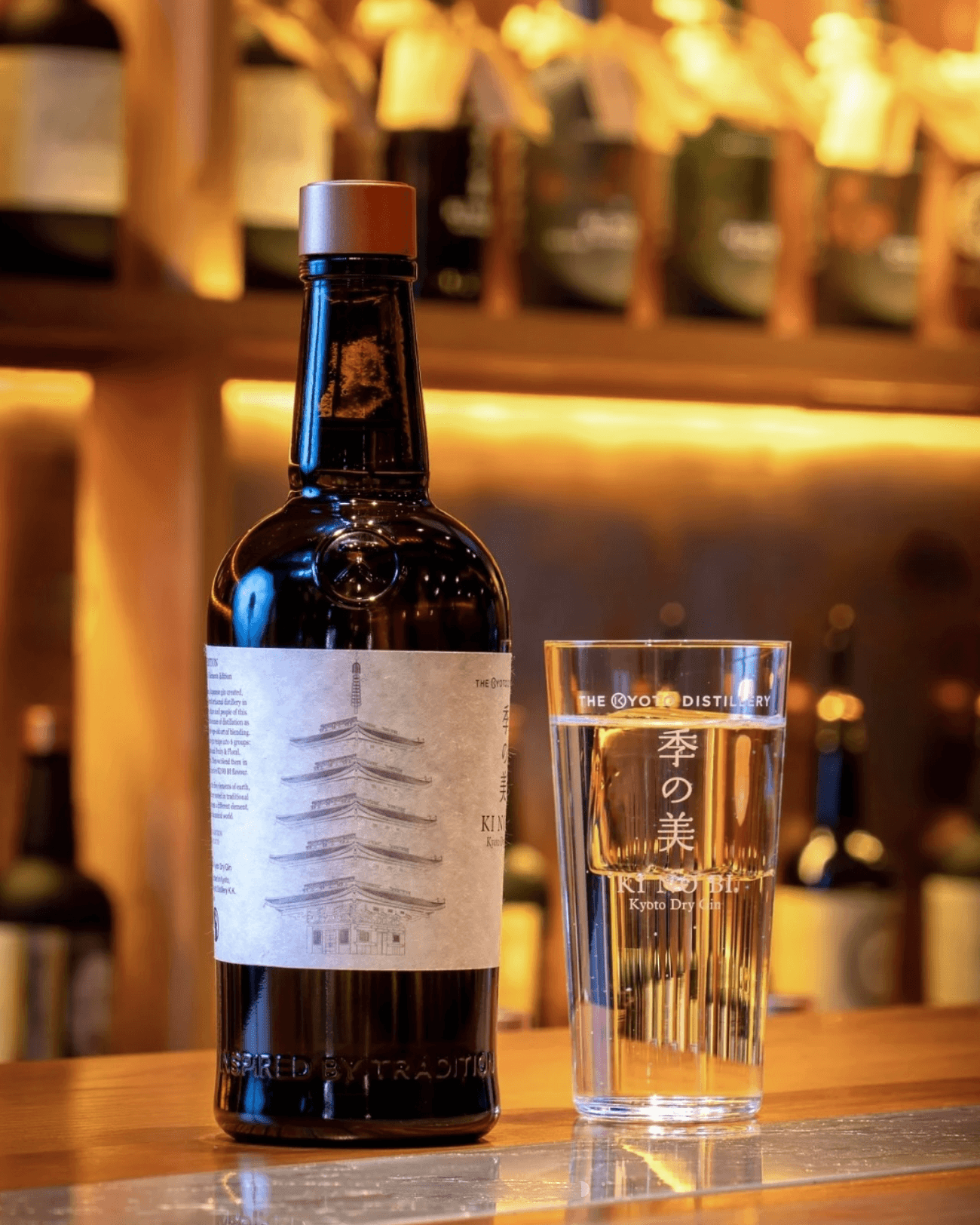 Ki No Bi Kyoto Dry Gin bottle displayed with its limited-edition packaging in a warm bar setting.
