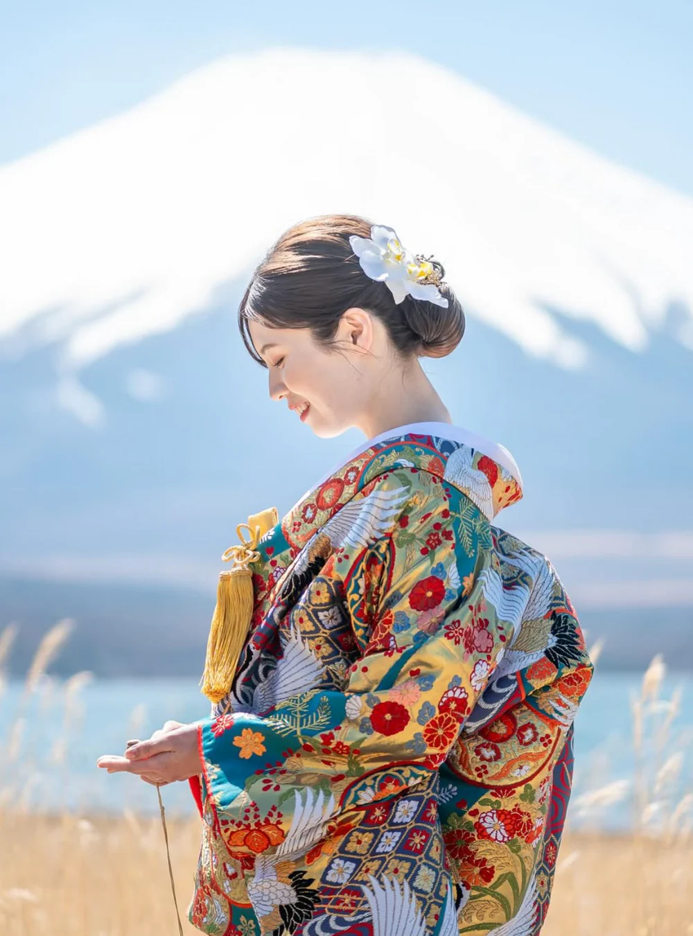 Bright, spacious gallery interior with vaulted white arches, tall windows, and reflective wooden floors