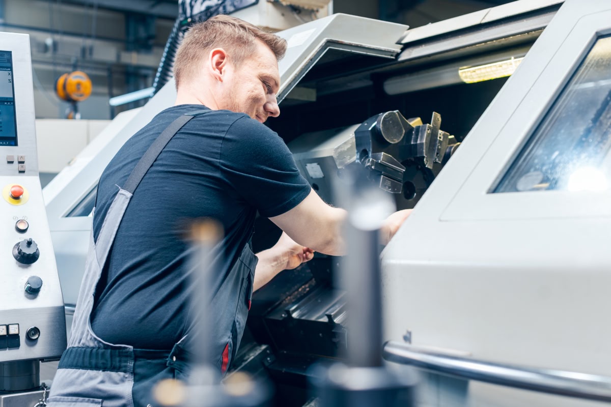 Sunlight streams through a patterned window into an arched hall.