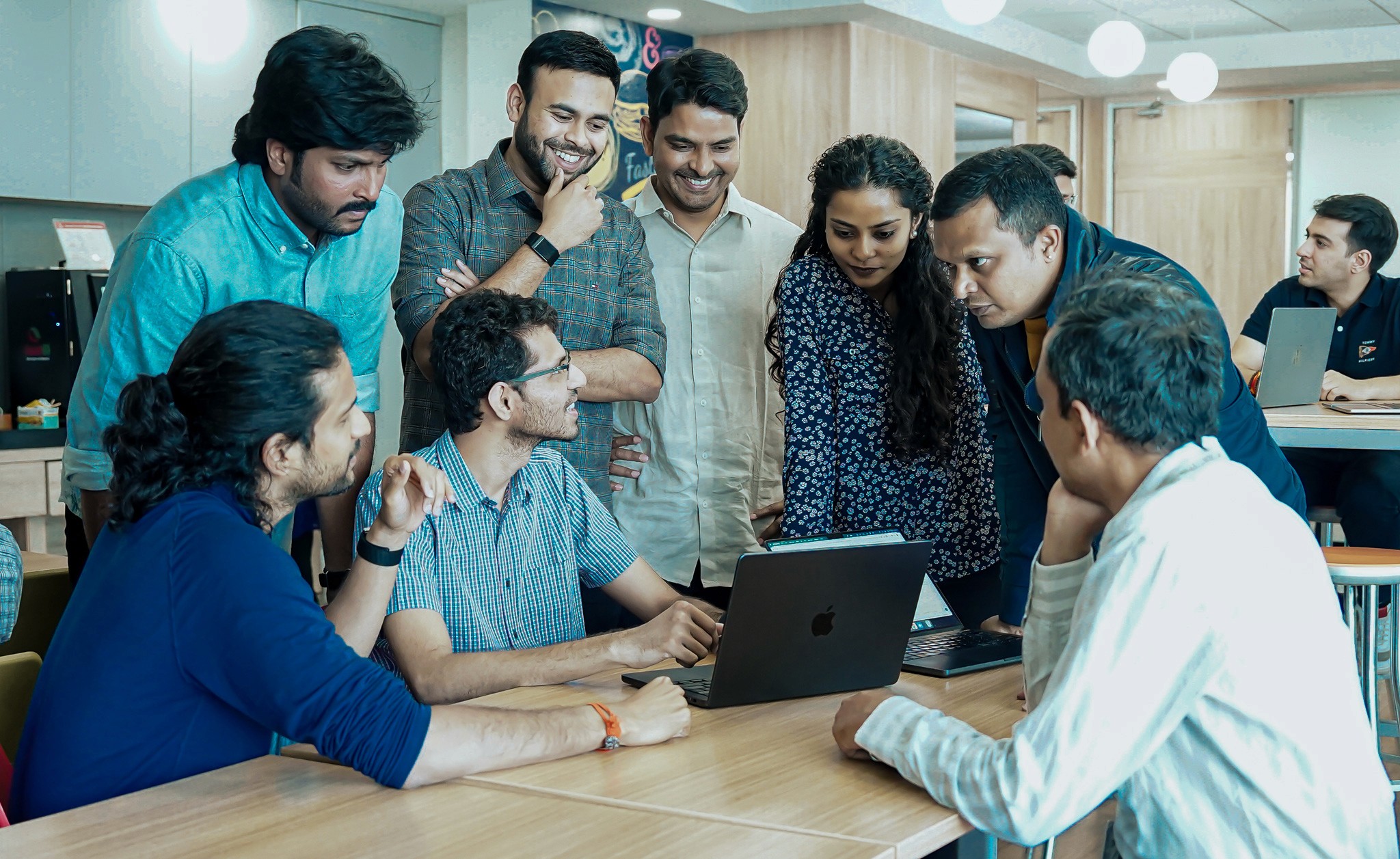 man sitting on chair and looking laptop computer