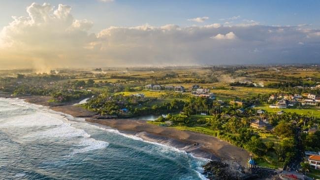 Aerial view of Pererenan coastline; let our real estate experts find your perfect seaside investment property.