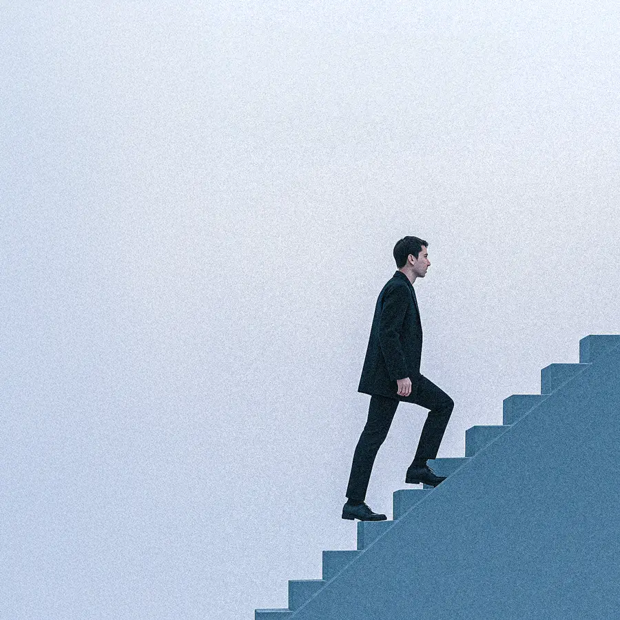 Man standing on the top of the stairs 