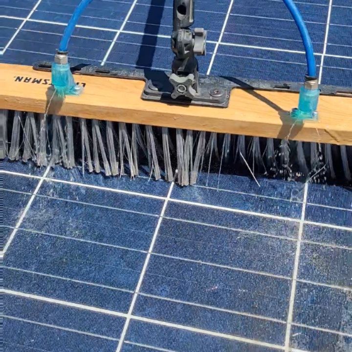 Rotating brush cleaning solar panels, close-up | Premier Solar Service
