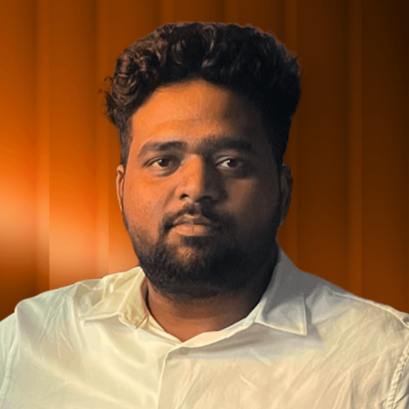 Profile portrait of a man in a white shirt against a light background
