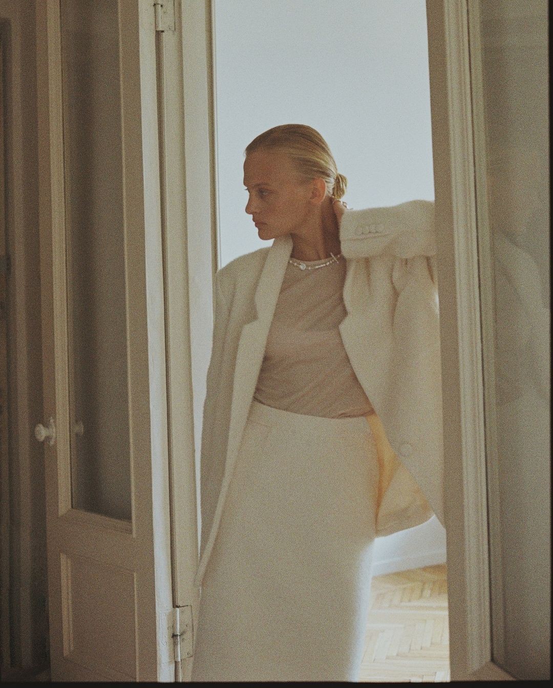 a blurry photo of a person standing in front of a wall