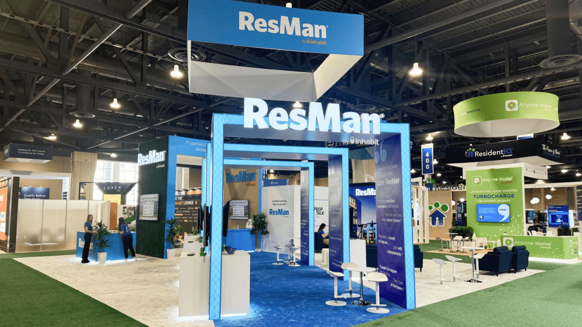ResMan Apartmentalize 2024 large island booth wide shot highlighting entry geometry, traffic flow, and overhead elements