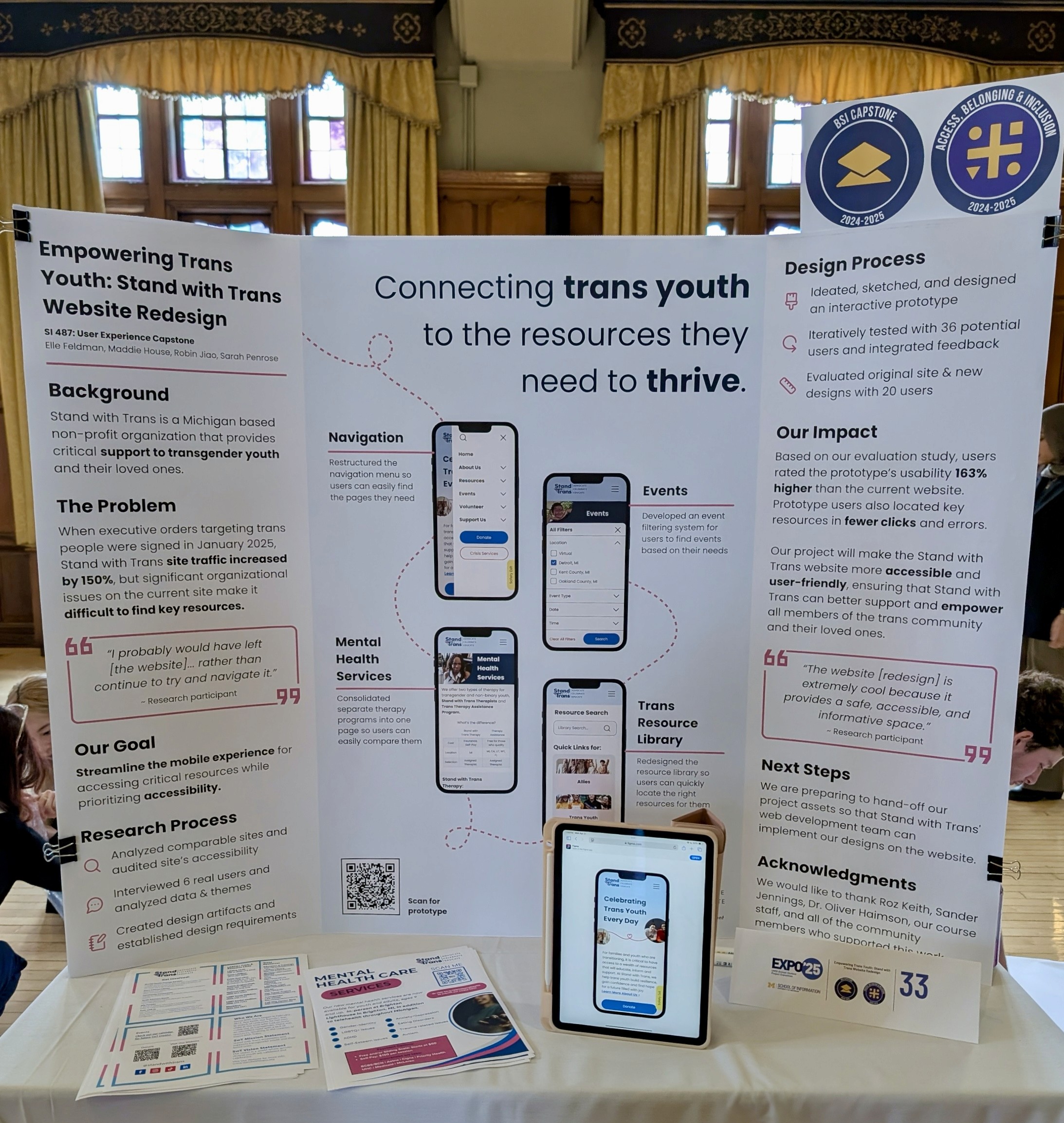 Tri-fold poster on table, titled "Connecting trans youth to the resources they need to thrive." Flyers and iPad with prototype sit in front of poster.