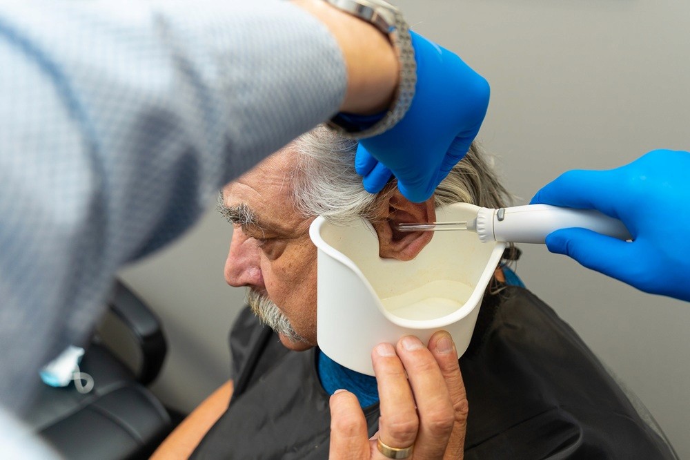 A person receiving an earwax removal treatment