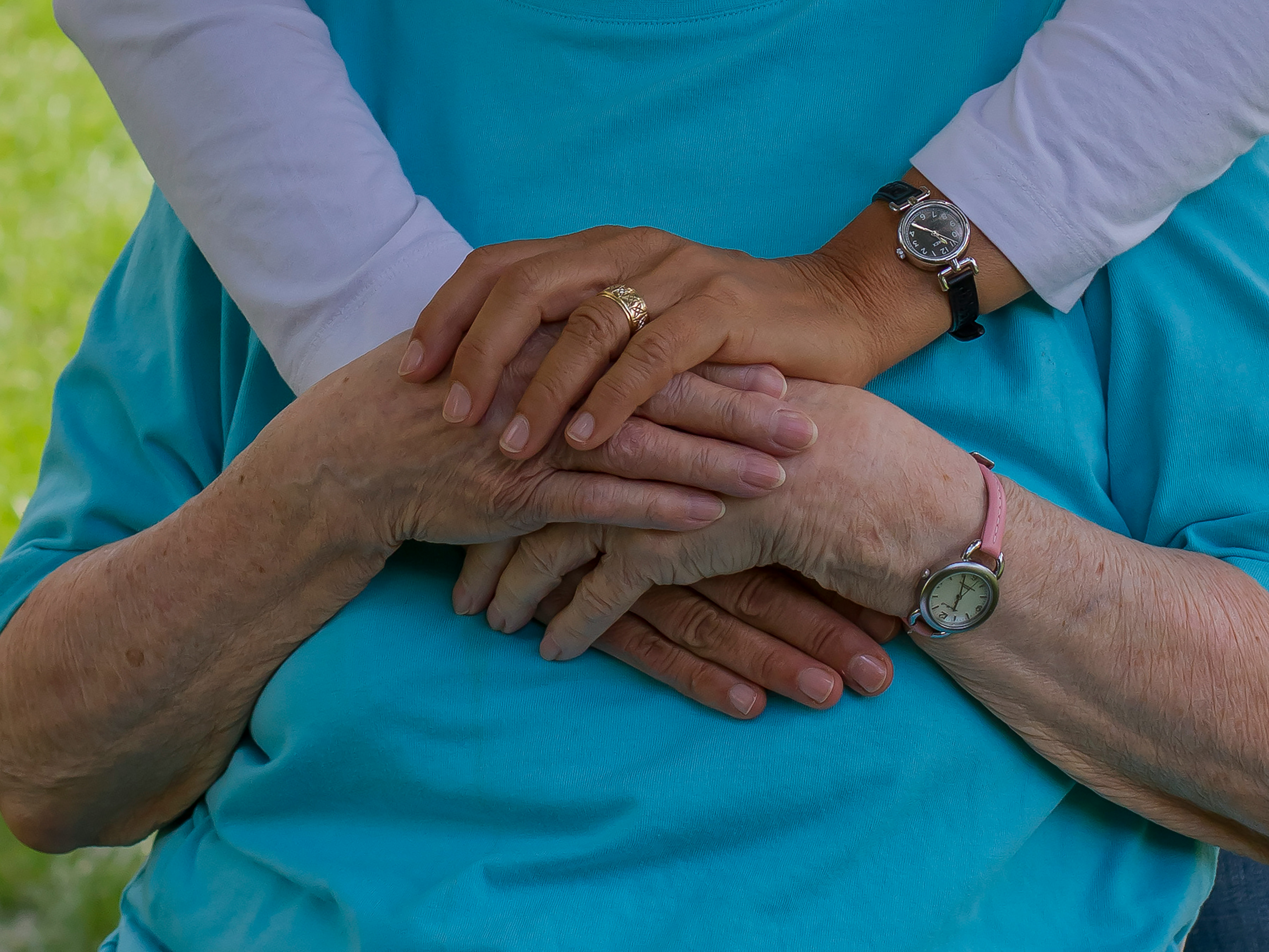 person wearing silver round analog watch