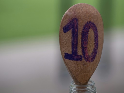 selective focus photography of brown ladle with inscription "10" illustrating The 10-Year Carte de Résident for Americans in France