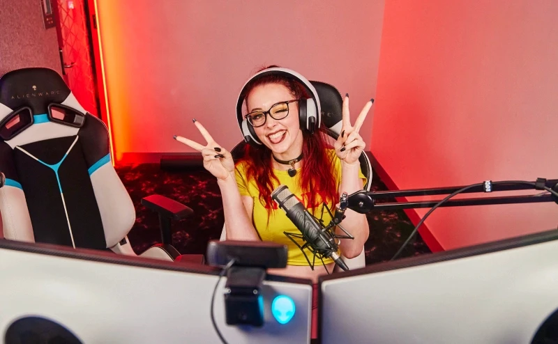 Person sitting in front of a computer, in the Streamer Pods at Fortress