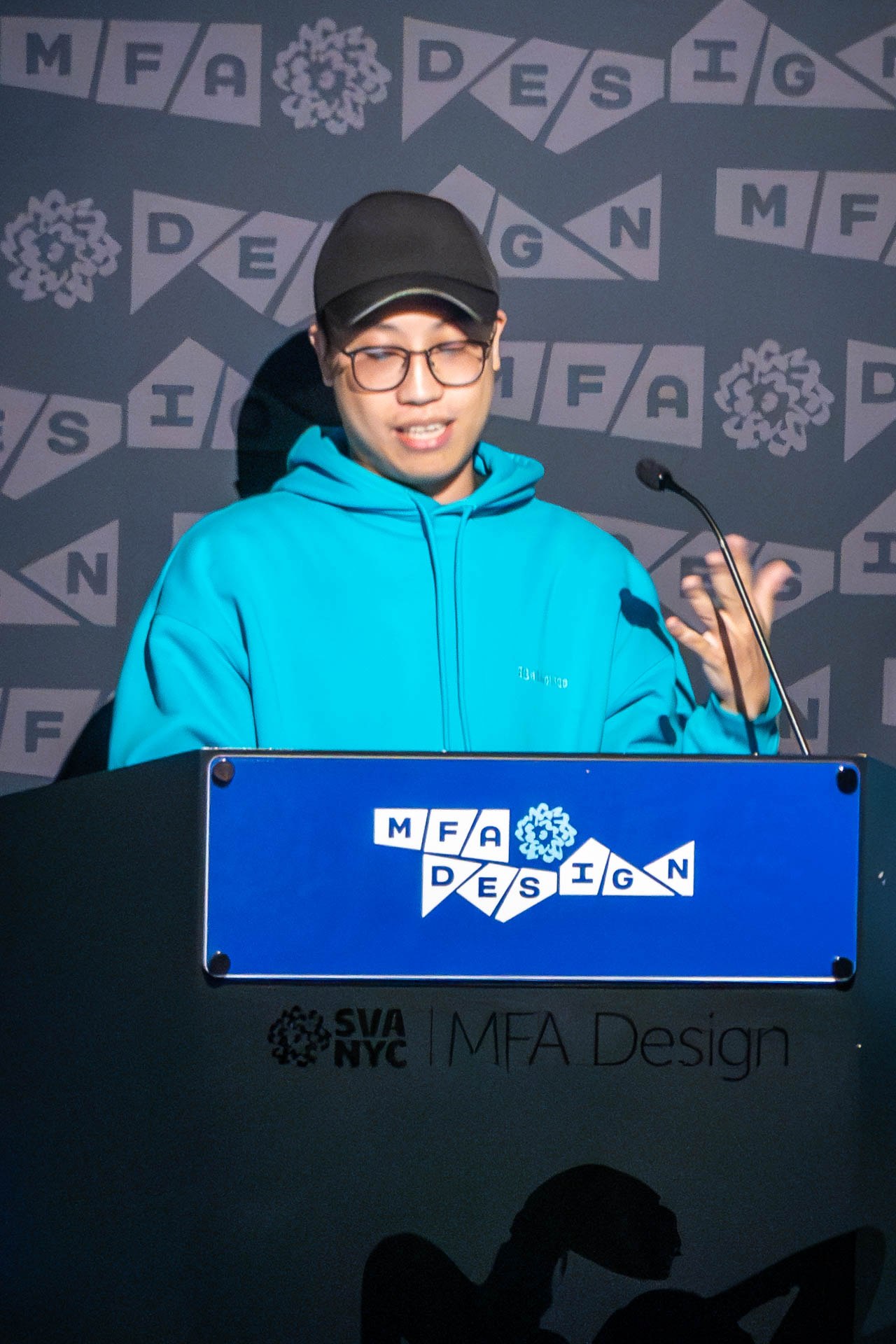 student at a podium giving a presentation