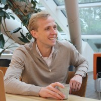 man wearing black crew-neck shirt