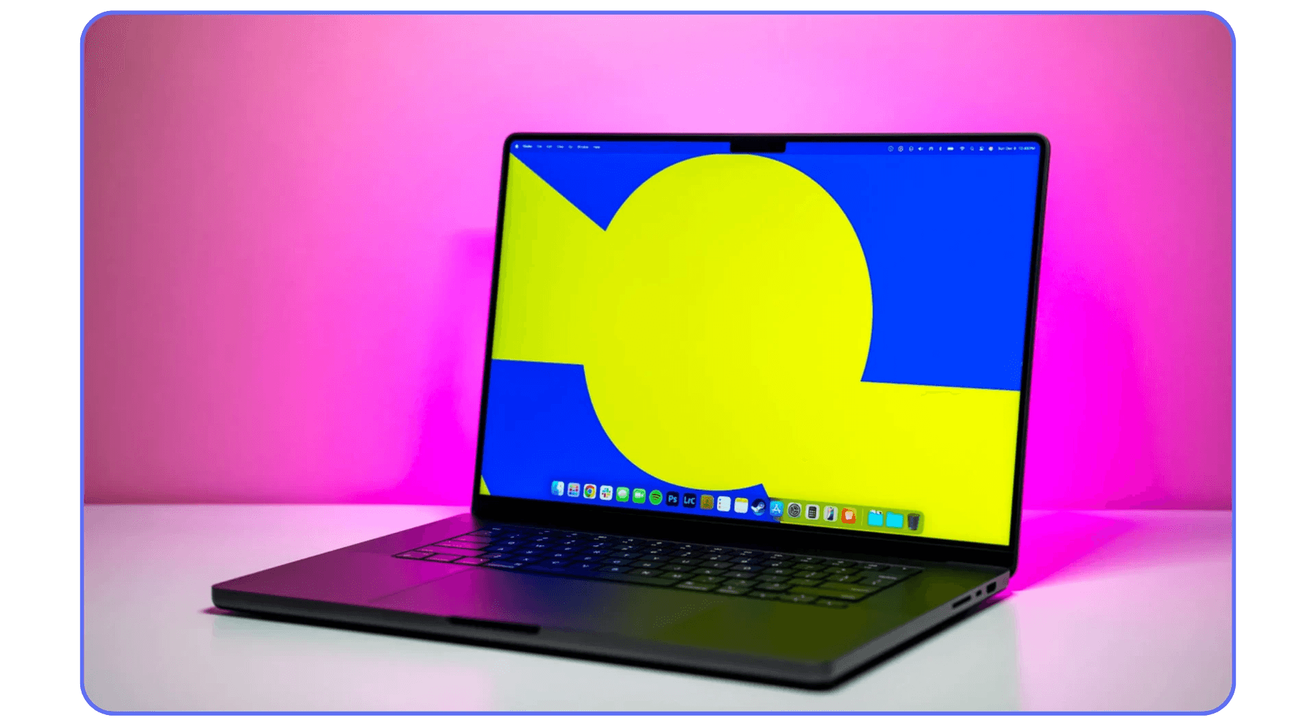 An Apple MacBook Pro 14-inch, displaying a vibrant yellow and blue abstract wallpaper on its screen, with a pink background.