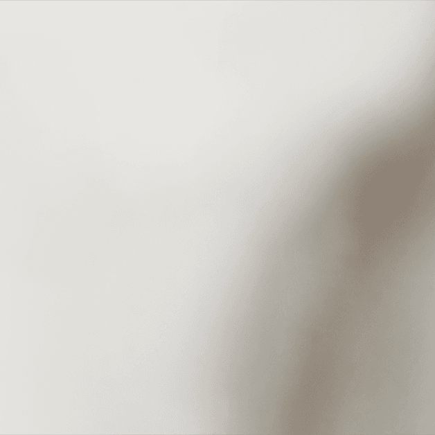 Hand holding a 250ml Almond Flat White can made with 100% Australian-grown coffee beans.