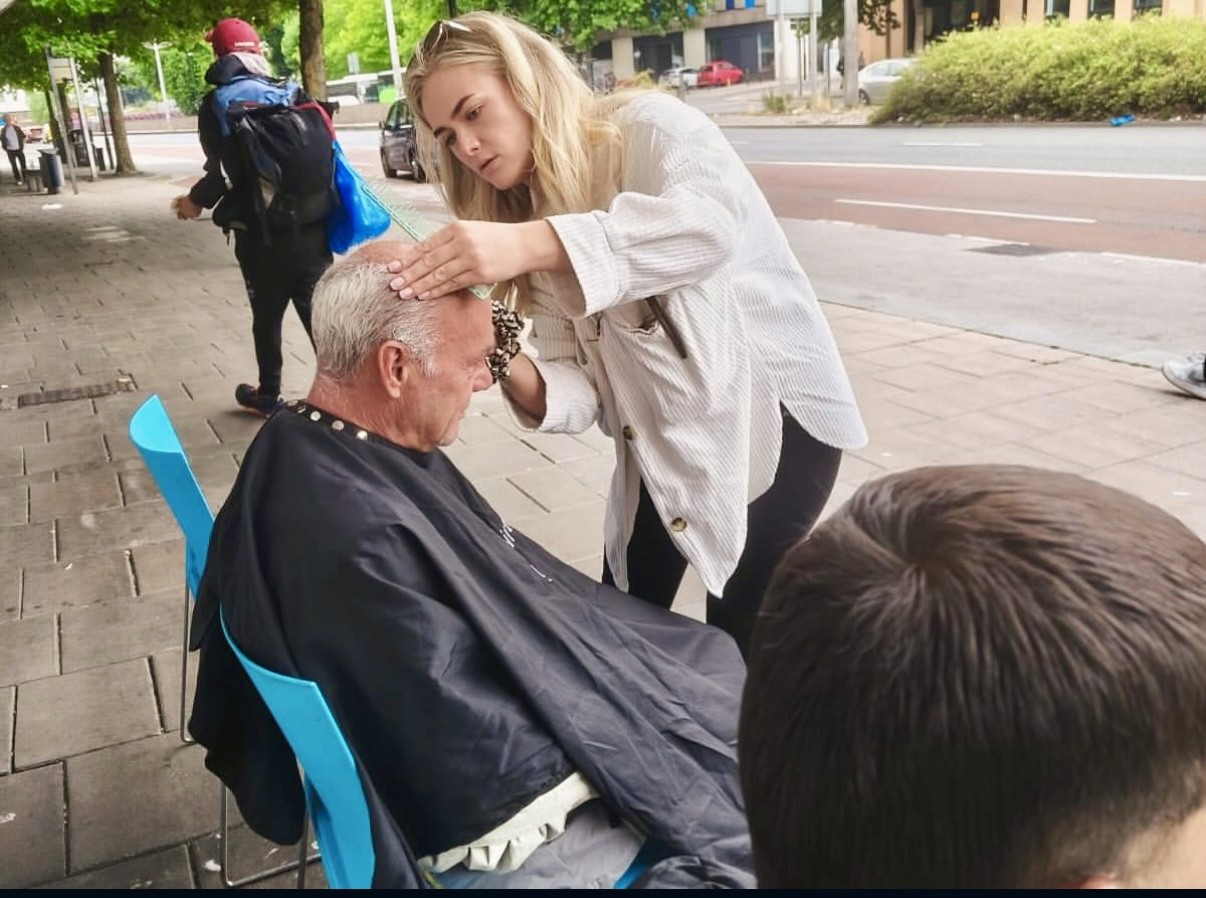Hair being cut on the street