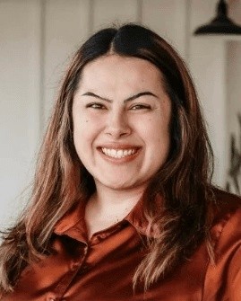 A woman smiling, representing Leaps & Bounds Pediatric Therapy staff.