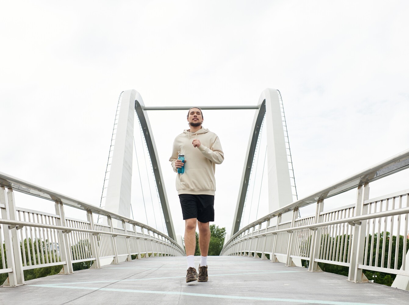 young man going for a jog outside to supplement his weight loss with pilates