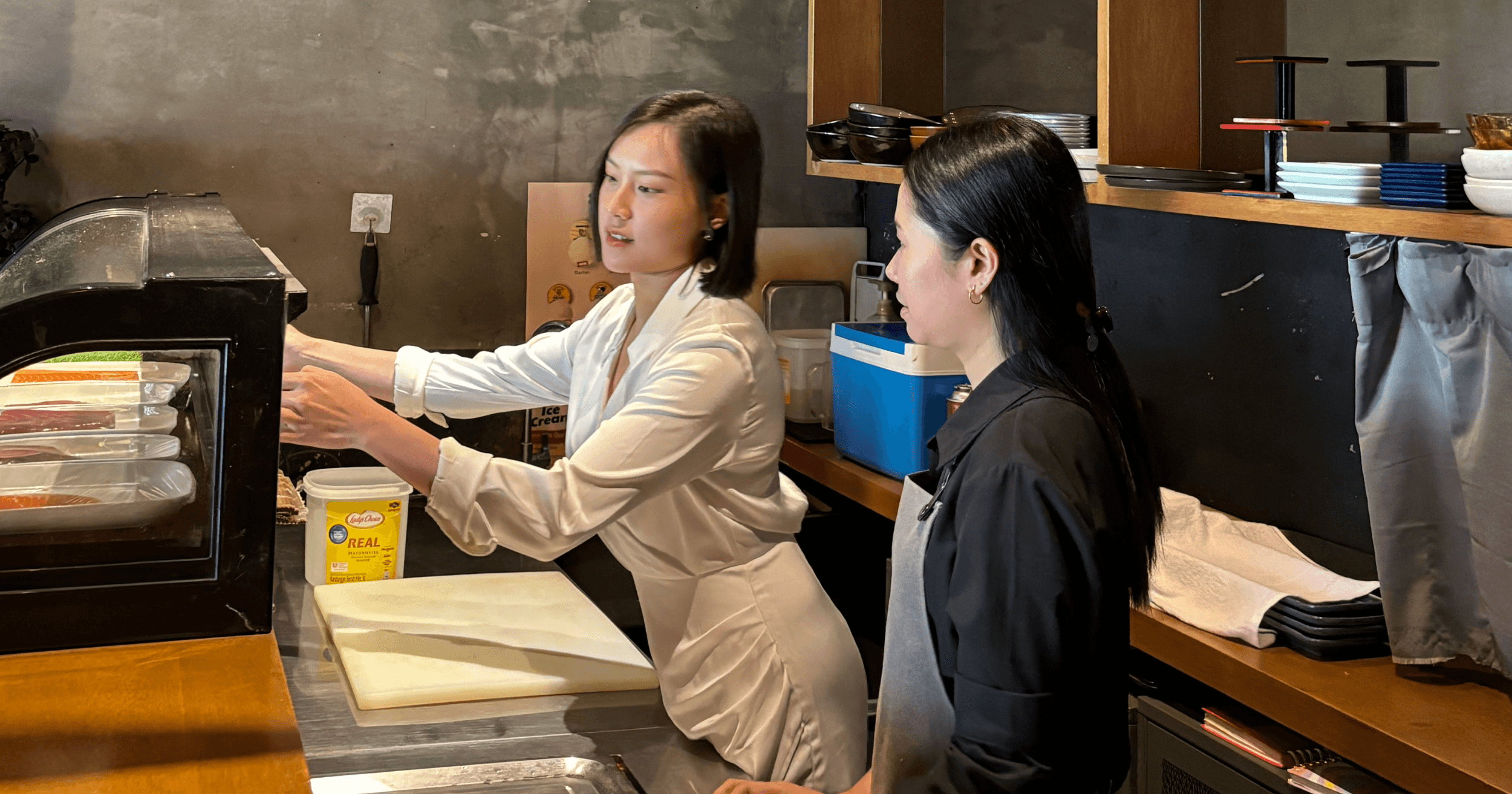 Sukee learning from her staff in Kyudon.