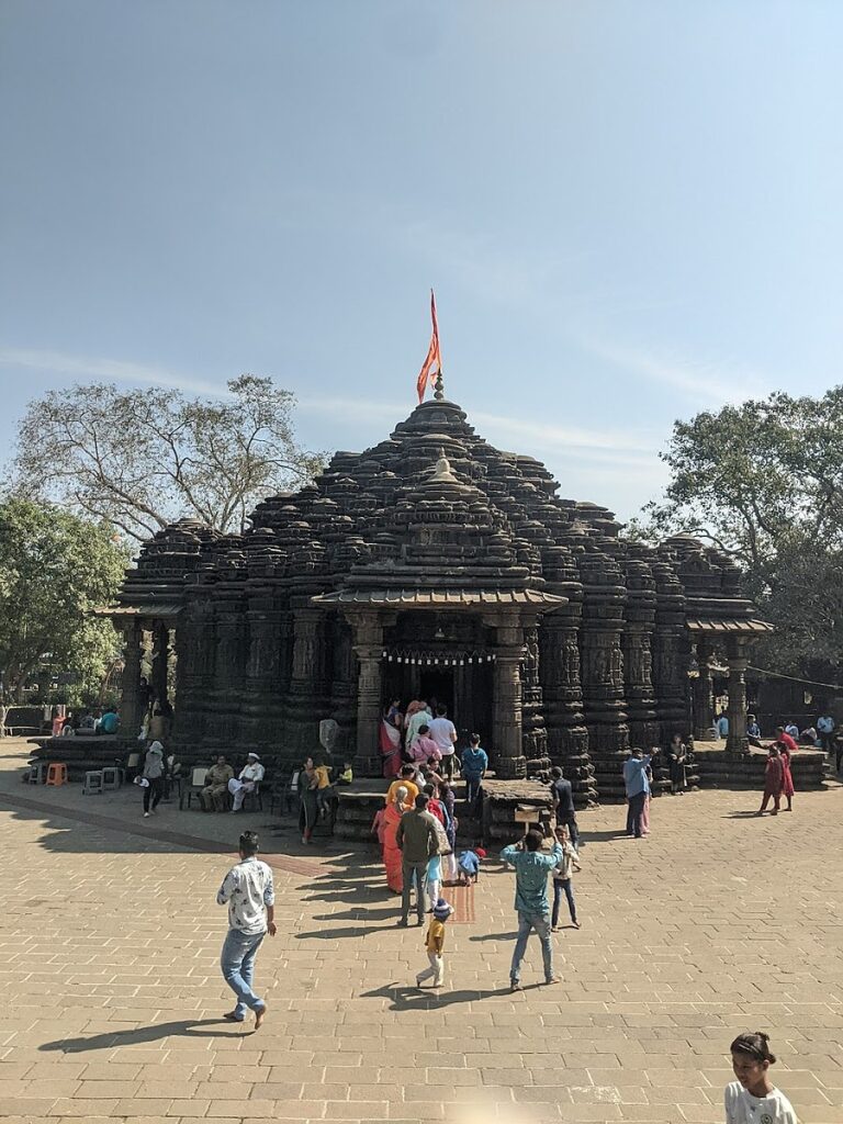 An ancient Shiv temple in Ambernath with a saffron flag fluttering atop and devotees queued up to take a darshan of Lord Shiva. 