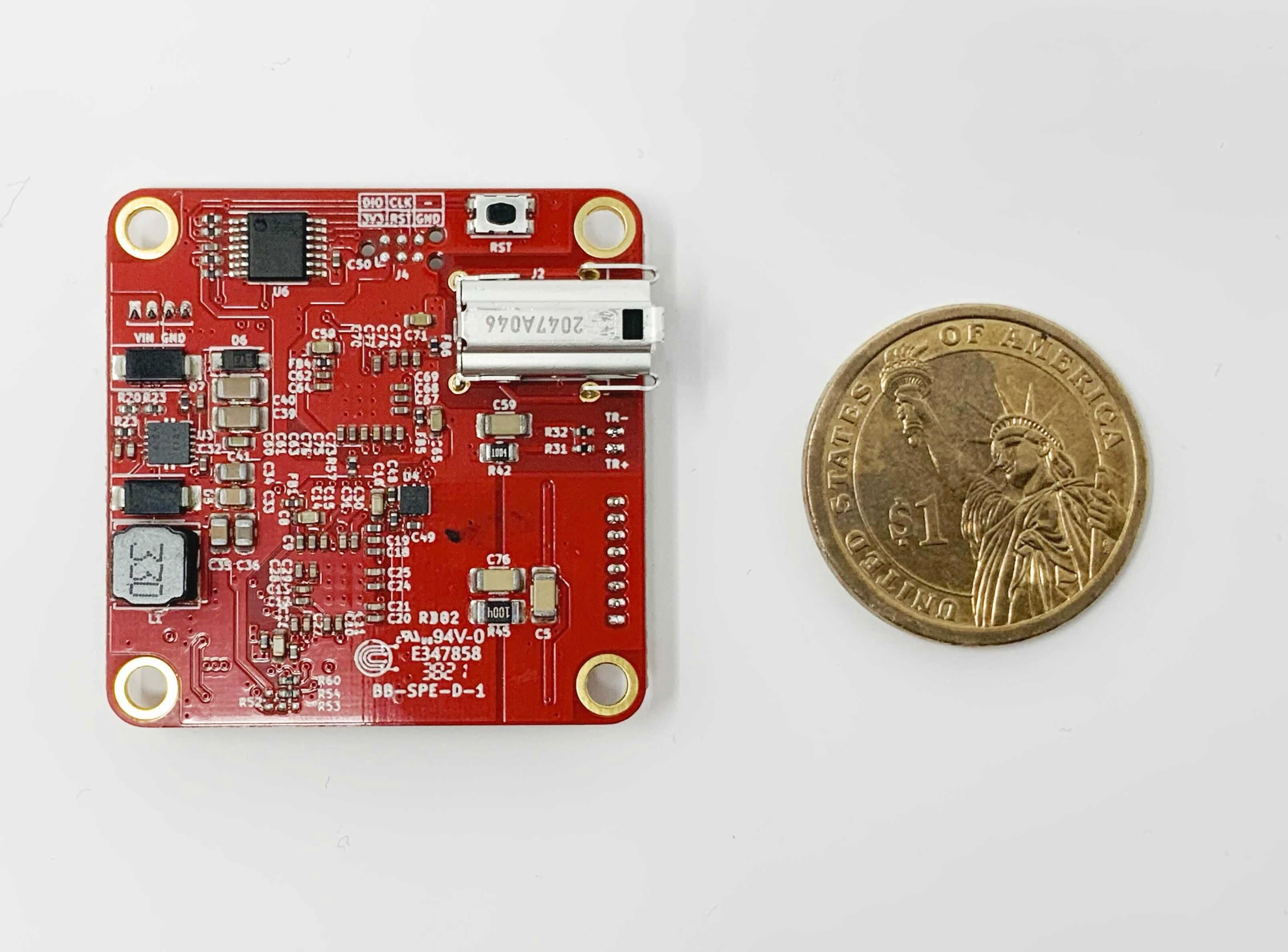 SPEBlox 1000BASE-T1 converter board next to a one-dollar coin for scale