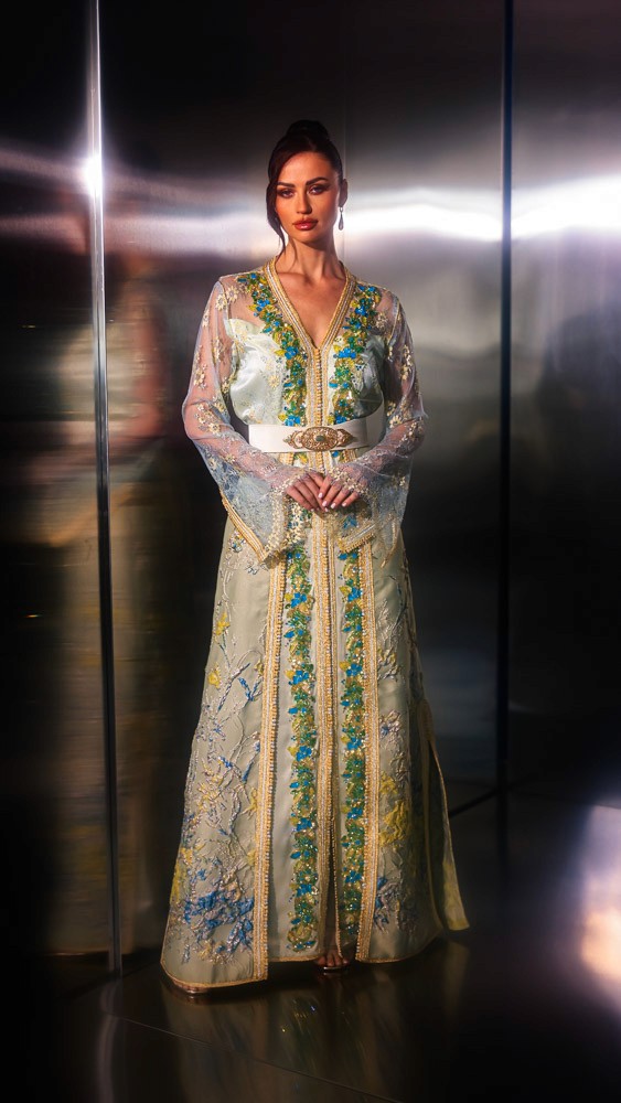Beige and gold Moroccan caftan with blue embroidery, handcrafted couture piece designed for luxury occasions in Bahrain